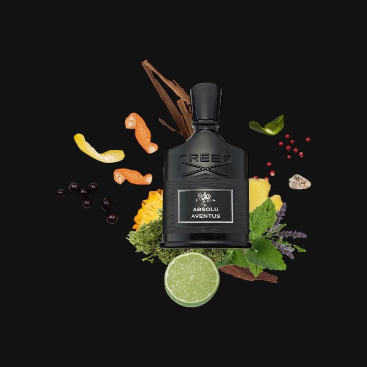 Absolu Aventus de Creed rodeado de sus ingredientes